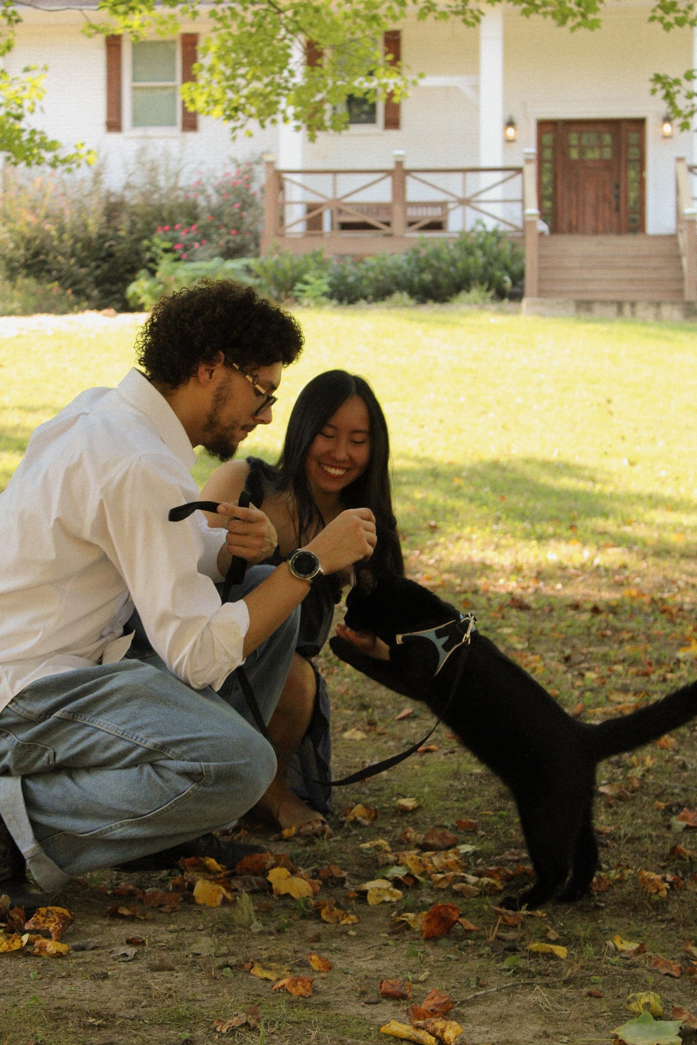 Eri and Eliana with their dog in the backyard